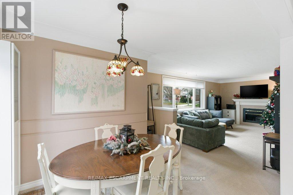 52 Sylvia Crescent, Hamilton, ON - Indoor Photo Showing Dining Room With Fireplace