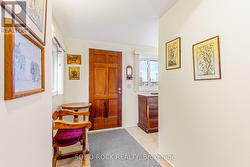 Front Foyer-pristine vinyl flooring & area carpets -