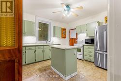 Kitchen-big bright window over kitchen ss sink -