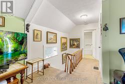 Upper landing looking down hall towards bath -