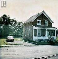 1984-Prior to closing in front porch/adding cedars -