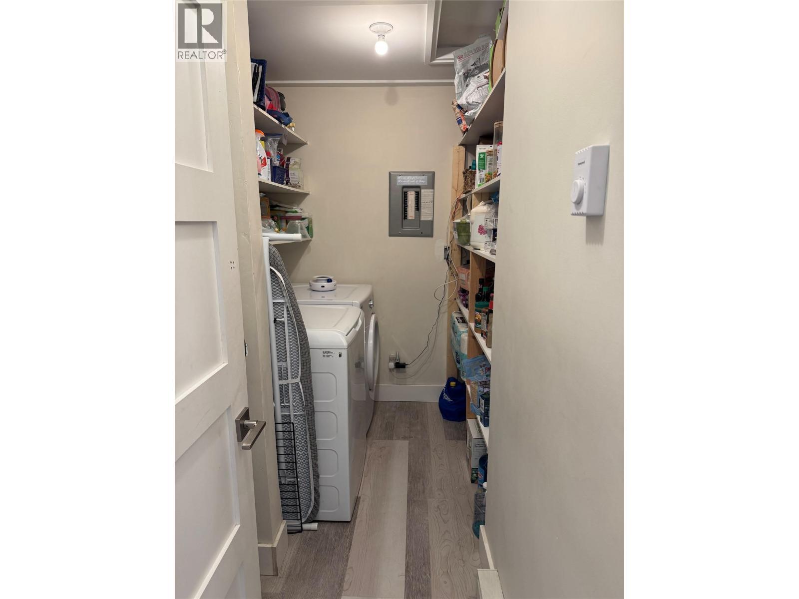 Storage room with laundry. - 1211 9Th Street Unit# 5, Golden, BC - Indoor Photo Showing Laundry Room