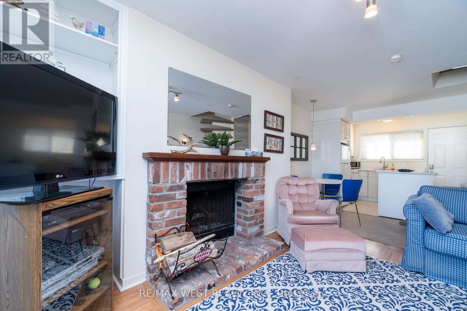 12A - 209513 Hwy 26, Blue Mountains, ON - Indoor Photo Showing Living Room With Fireplace