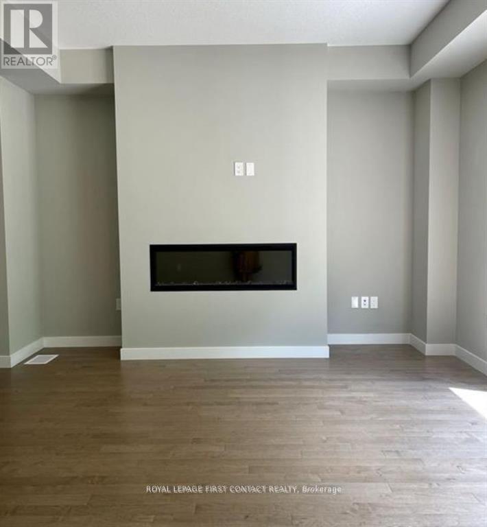 924 Robert Ferrie Drive, Kitchener, ON - Indoor Photo Showing Other Room With Fireplace