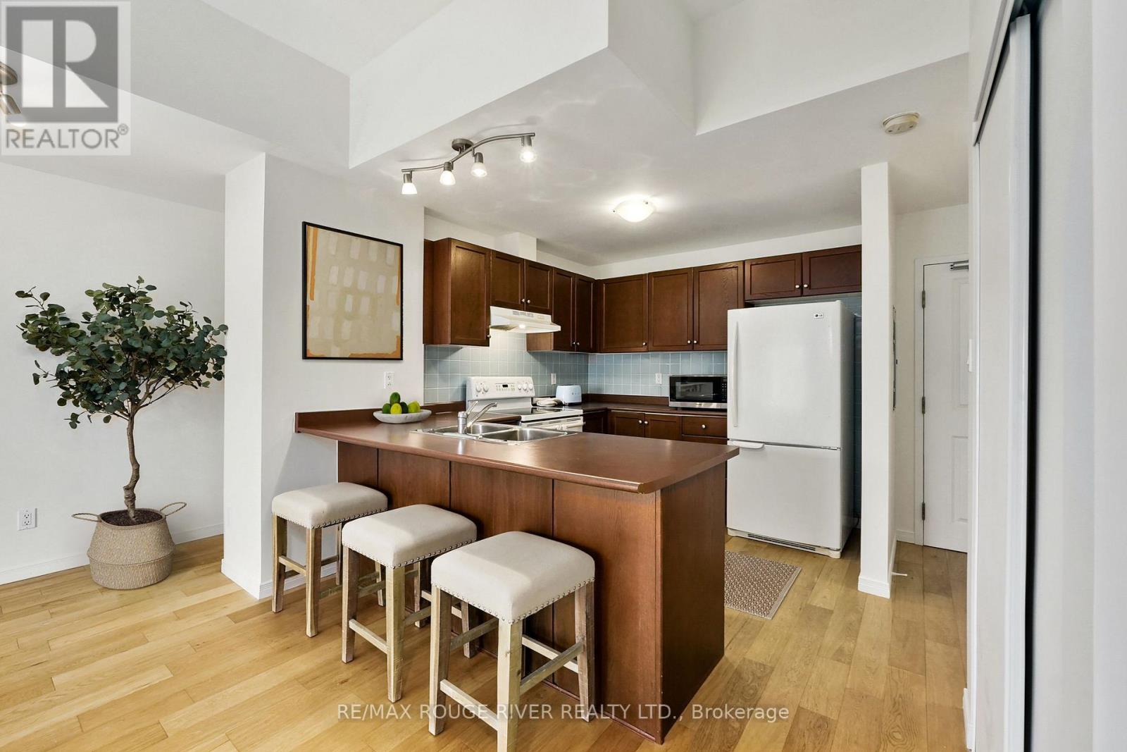 Photo has been digitally staged - 309 - 145 Third Street, Cobourg, ON - Indoor Photo Showing Kitchen
