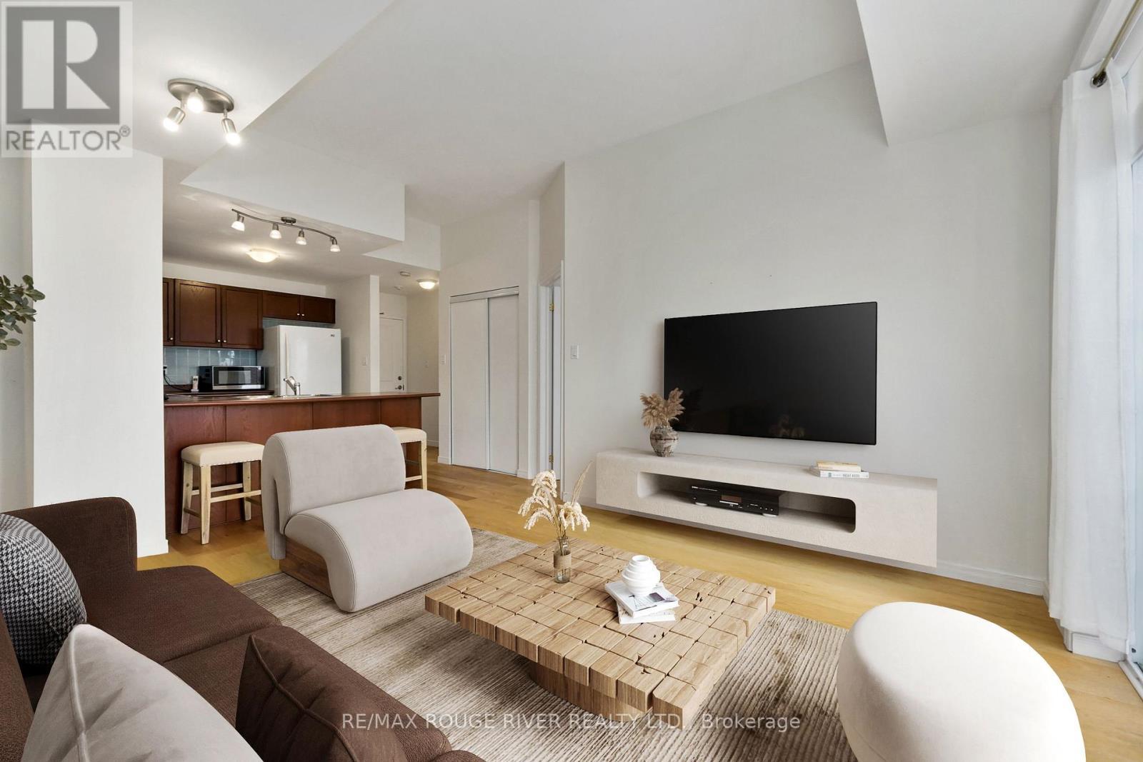 Photo has been digitally staged - 309 - 145 Third Street, Cobourg, ON - Indoor Photo Showing Living Room