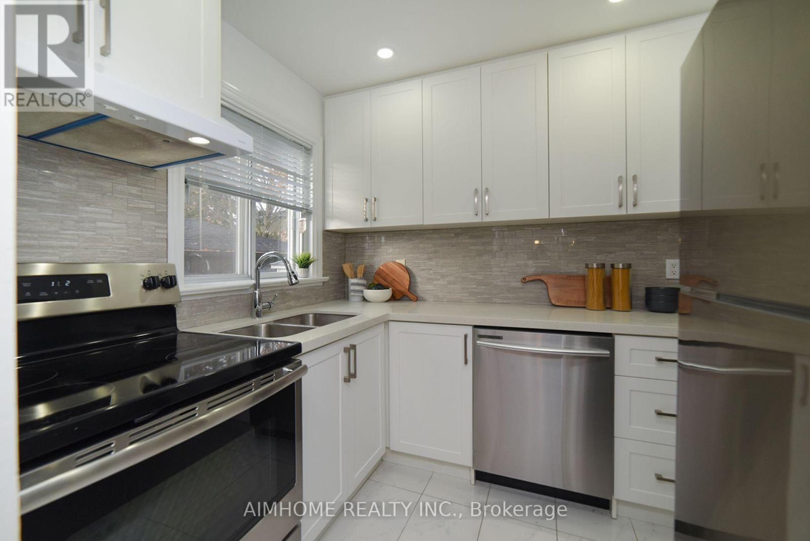 18 Ilfracombe Crescent, Toronto, ON - Indoor Photo Showing Kitchen With Double Sink