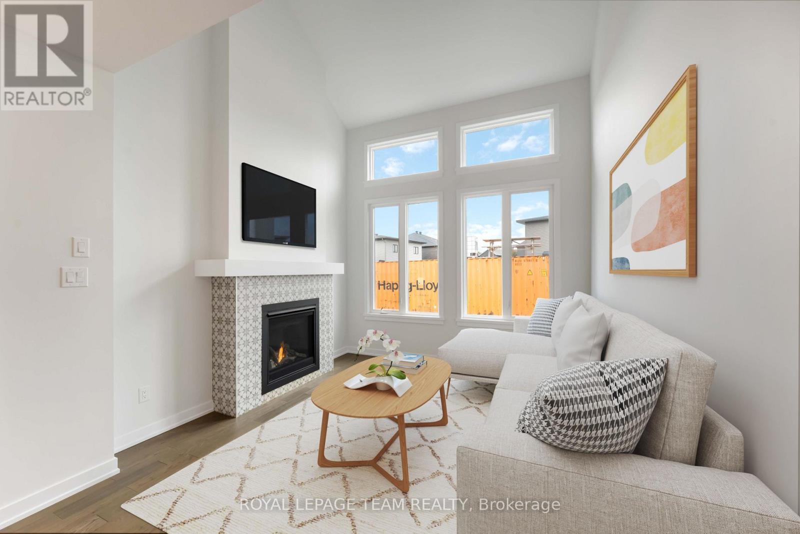 This image is virtually staged. - 91 Gartersnake Way, Ottawa, ON - Indoor Photo Showing Living Room With Fireplace