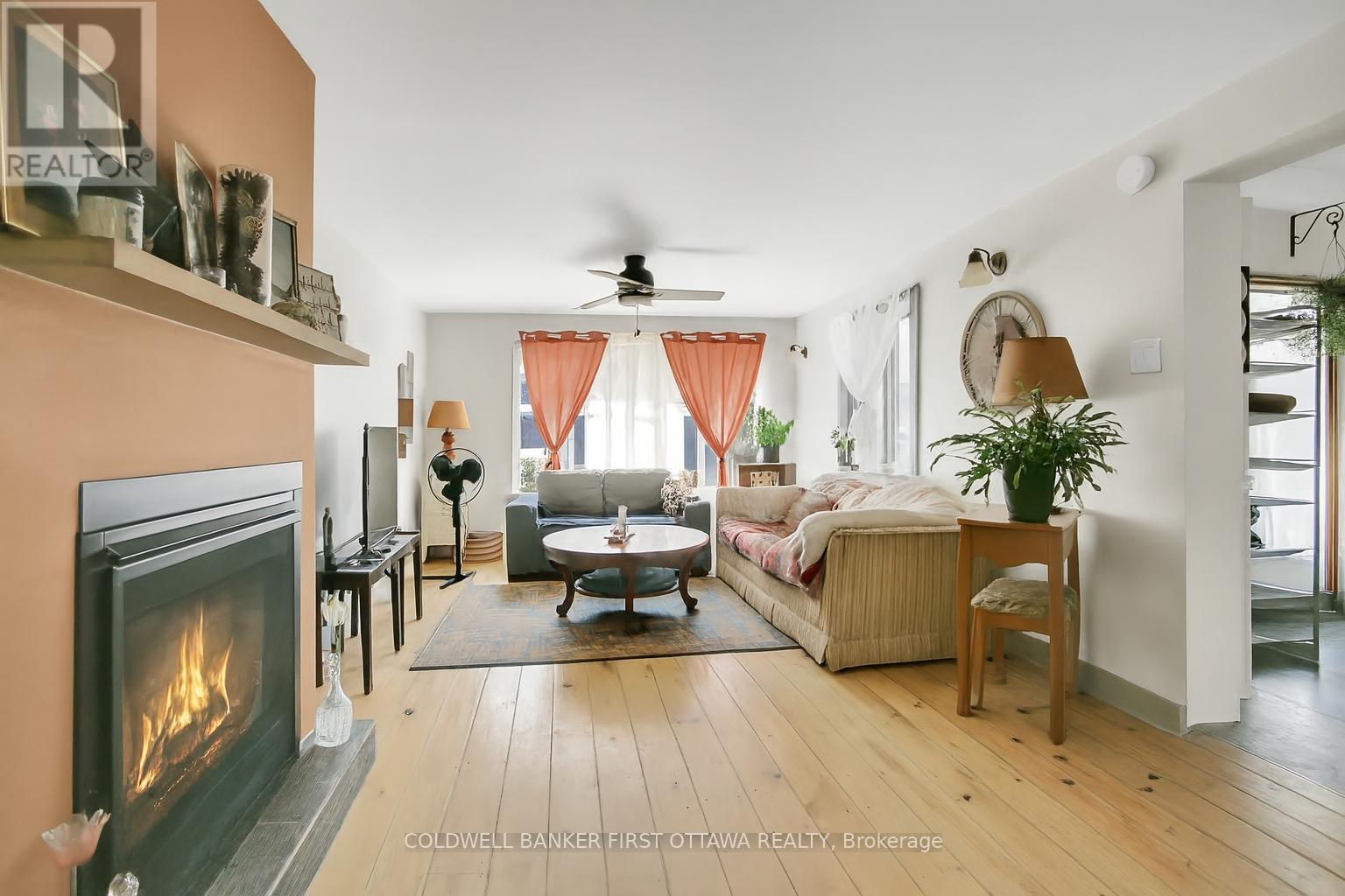 Propane fireplace with family room - 6 Fetherston Lane, North Grenville, ON - Indoor Photo Showing Living Room With Fireplace