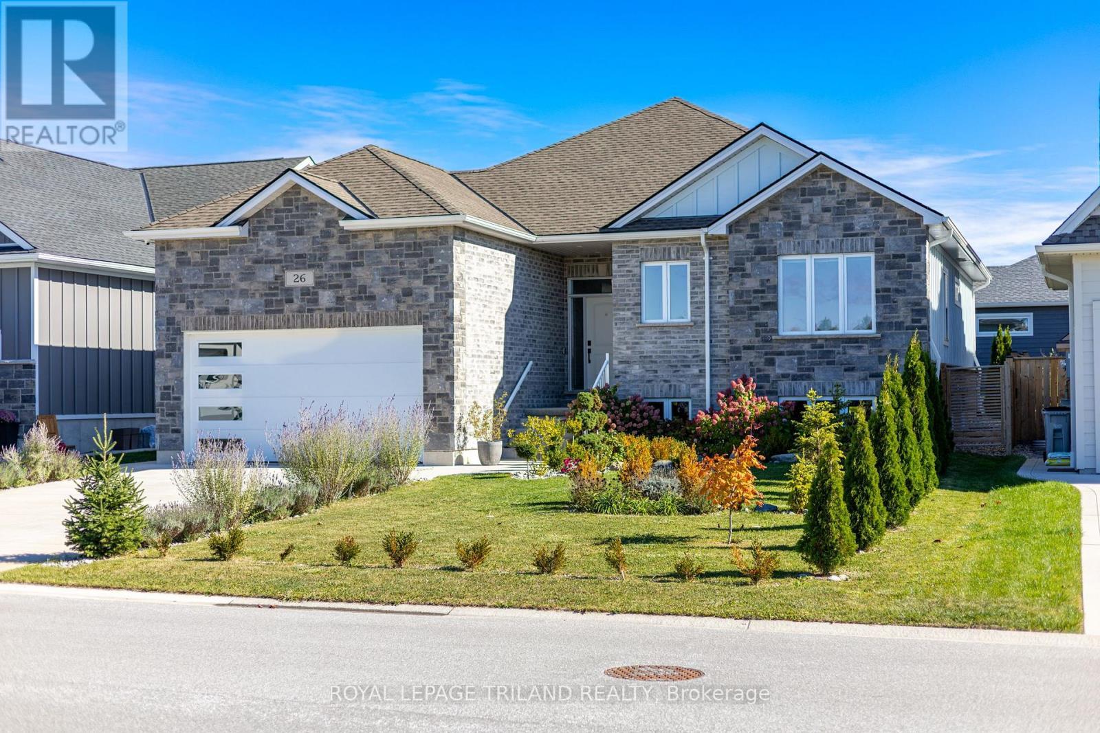 Excellent 2020 stone & brick 3430 sq ft bungalow! - 26 Tattersall Lane, Lambton Shores (Grand Bend), ON - Outdoor With Facade
