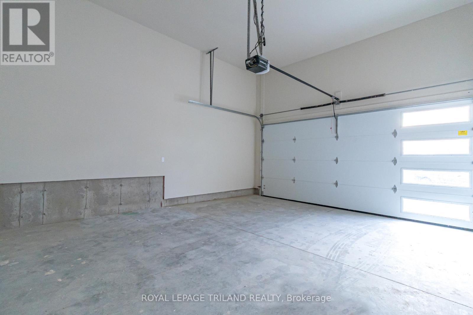 FULLY INSULATED 2-car garage. - 26 Tattersall Lane, Lambton Shores (Grand Bend), ON - Indoor Photo Showing Garage