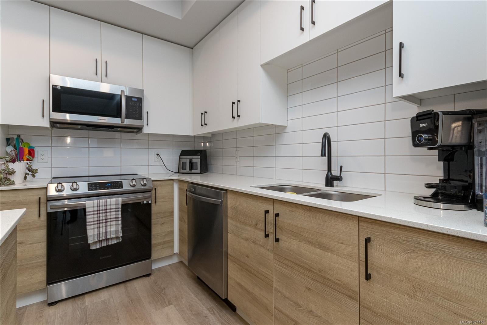 204-2465 Gateway Rd, Langford, BC - Indoor Photo Showing Kitchen With Stainless Steel Kitchen With Double Sink