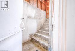 Stairway featuring concrete floors -