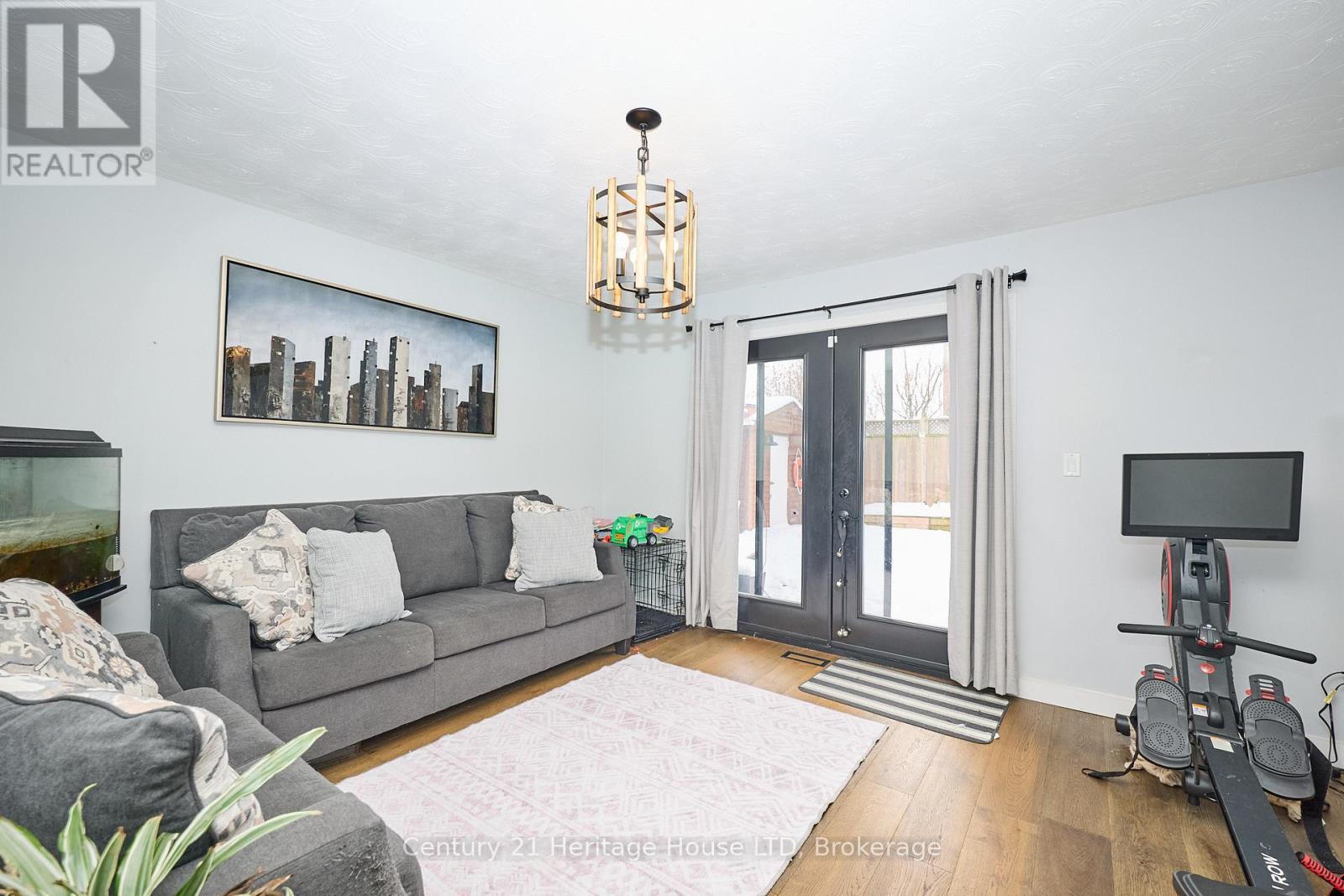 Family Room with walkout to pool - 70 Taymall Street, Hamilton (Templemead), ON - Indoor Photo Showing Living Room