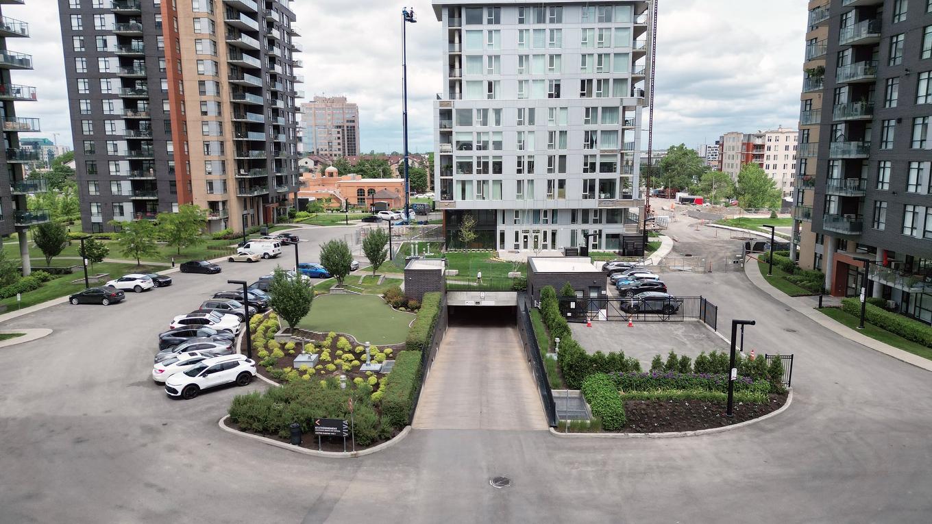 Photo aérienne - 1202-2835 Av. Du Cosmodôme, Laval (Chomedey), QC - Outdoor With Facade