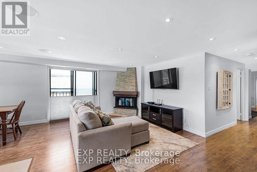 104 - 15390 Yonge Street, Aurora, ON - Indoor Photo Showing Living Room With Fireplace