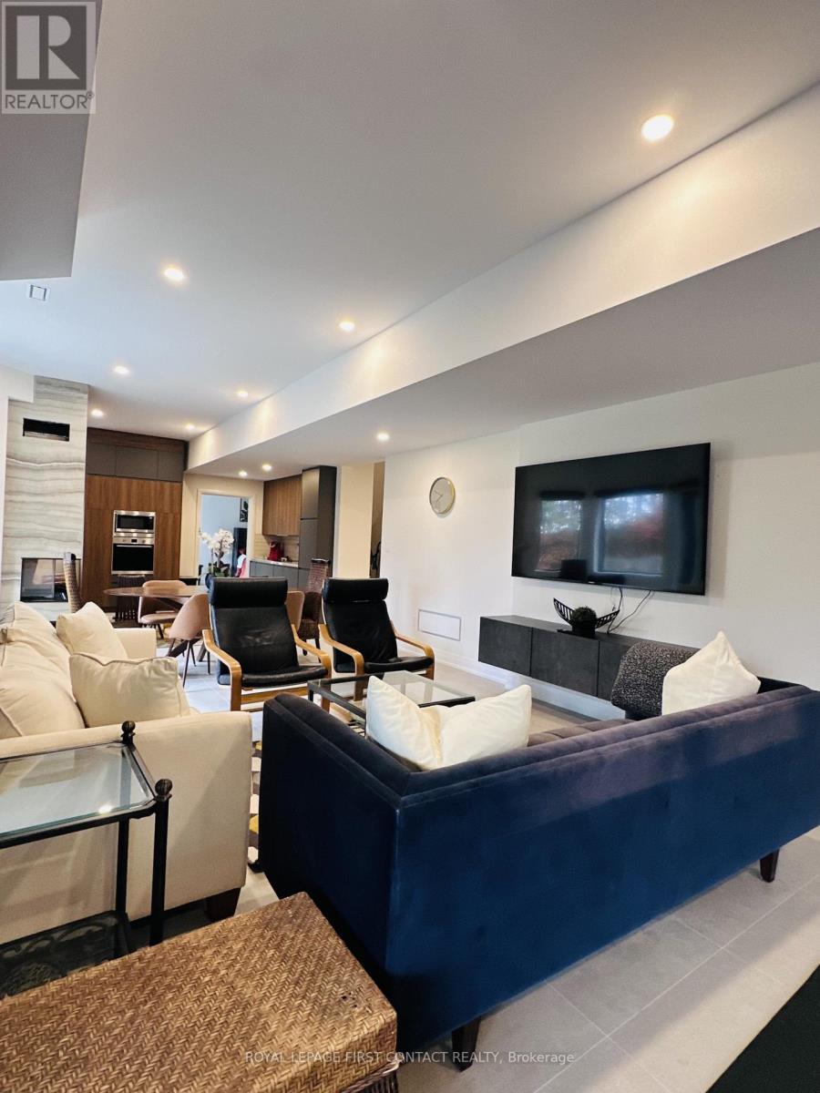 4B Pierce Court, Springwater, ON - Indoor Photo Showing Living Room With Fireplace