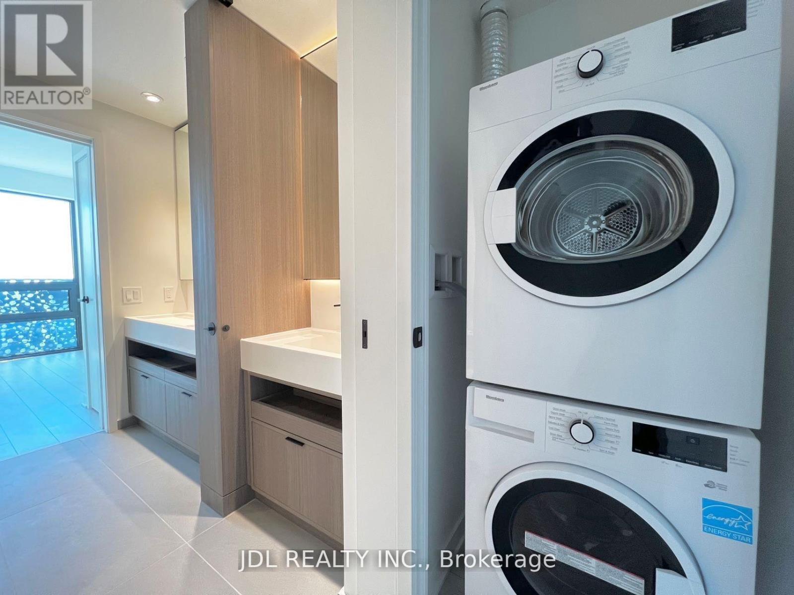 4201 - 55 Charles Street E, Toronto, ON - Indoor Photo Showing Laundry Room