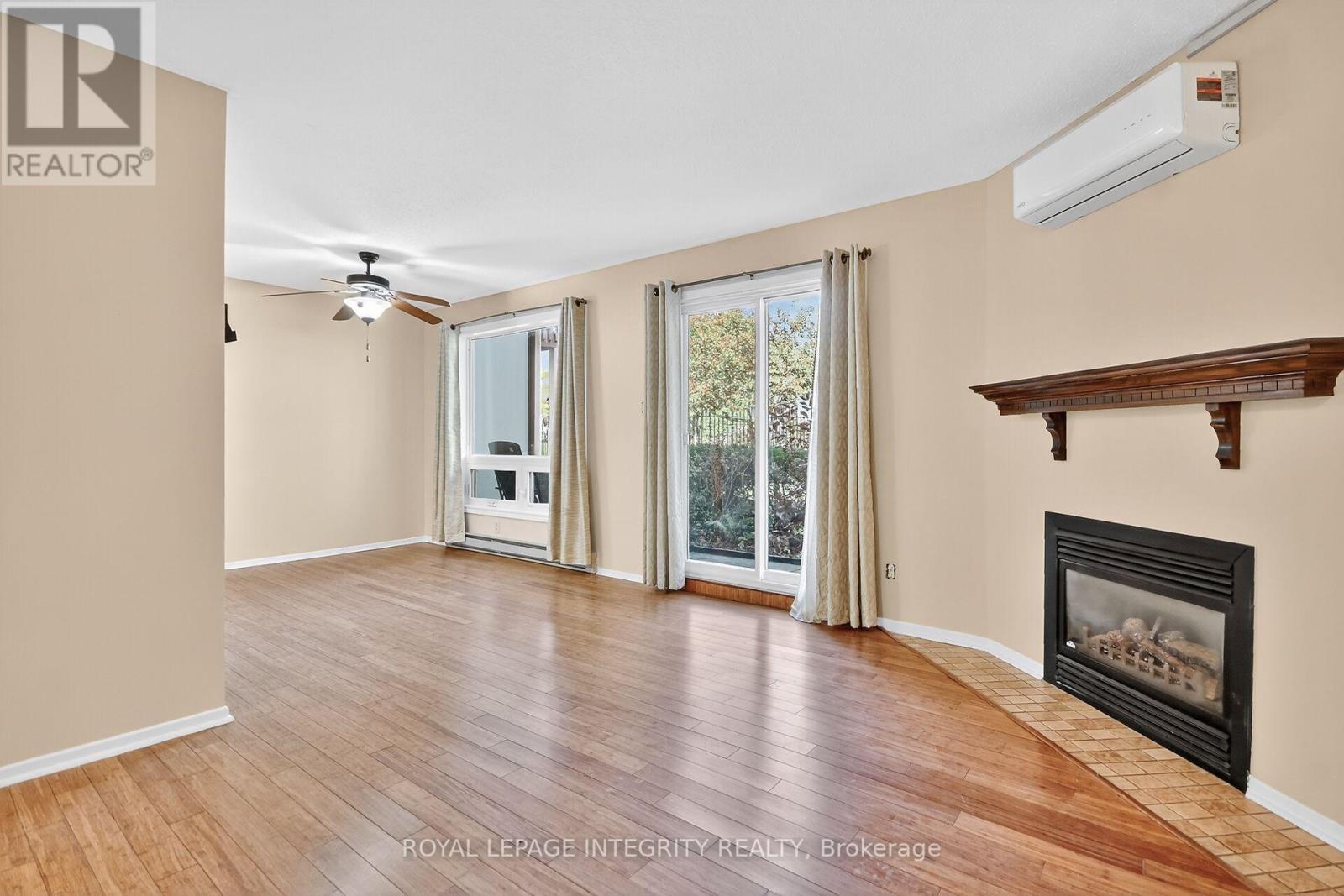 A - 214 Equestrian Drive N, Ottawa, ON - Indoor Photo Showing Living Room With Fireplace