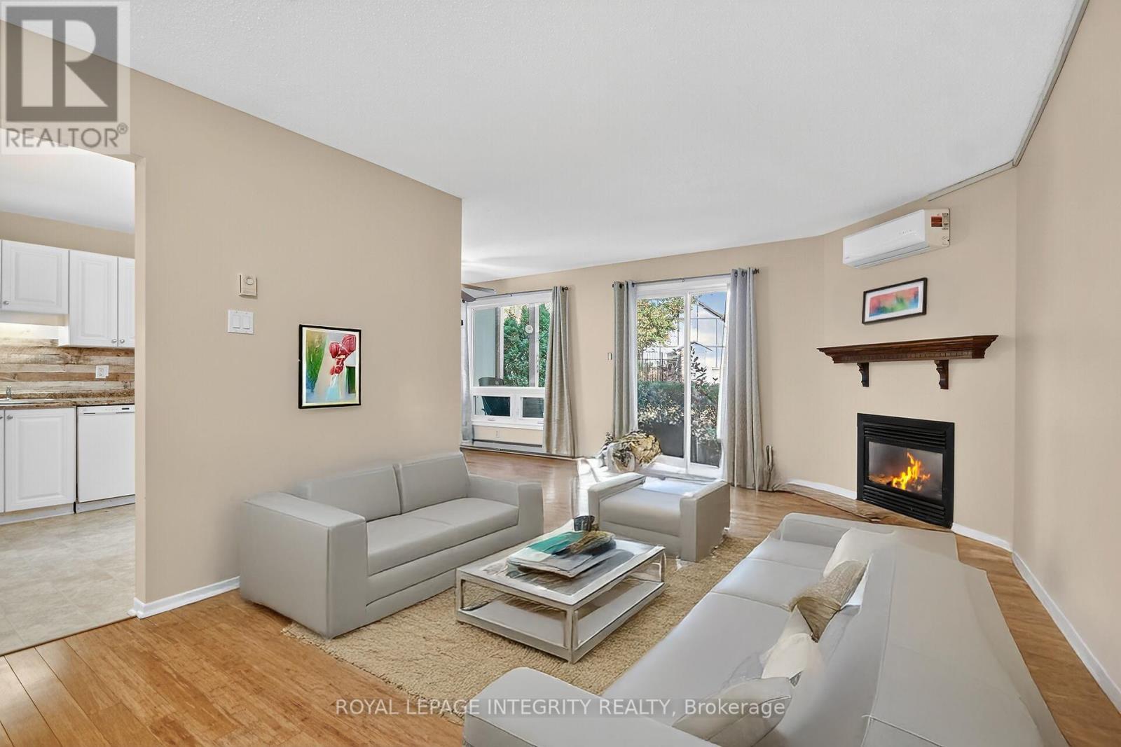 A - 214 Equestrian Drive N, Ottawa, ON - Indoor Photo Showing Living Room With Fireplace