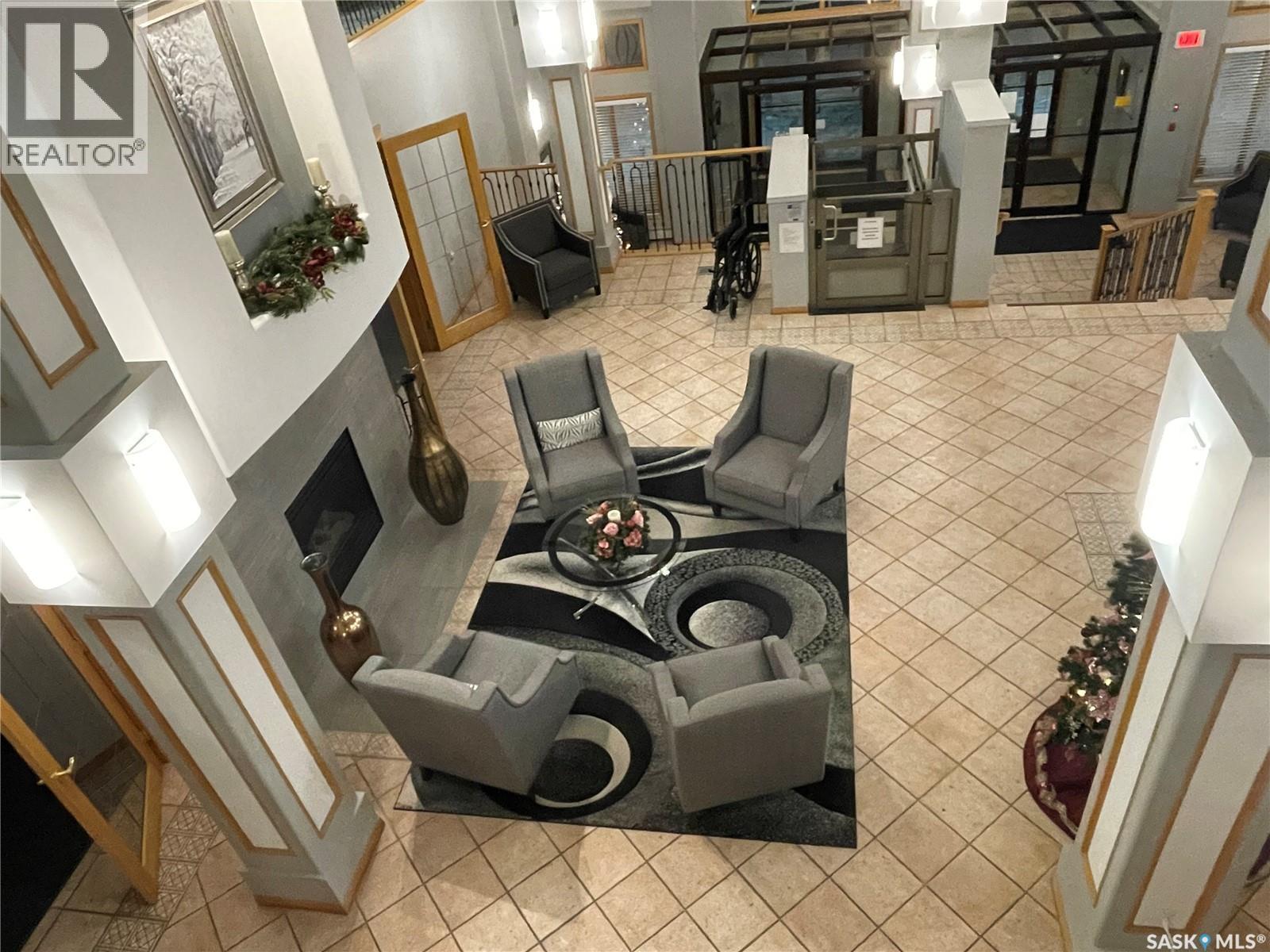 340 325 Keevil Crescent, Saskatoon, SK - Indoor Photo Showing Other Room With Fireplace