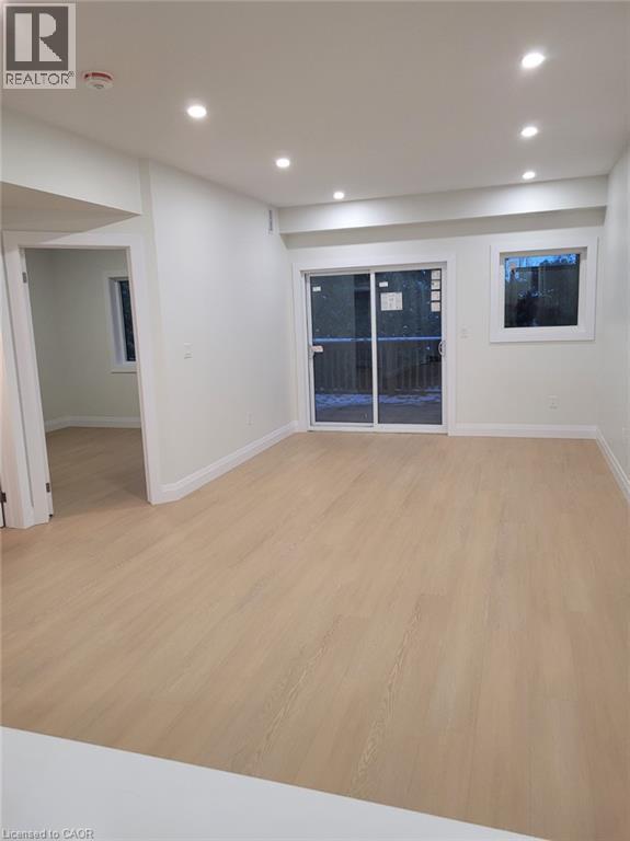 Empty room featuring light wood finished floors and recessed lighting - 269 Dumfries Avenue Unit# Main, Kitchener, ON - Indoor