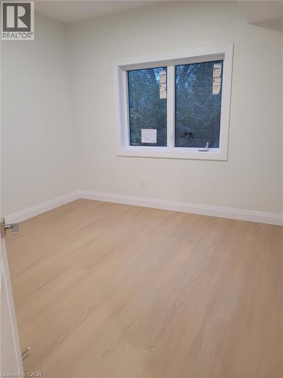 Spare room featuring light wood-style flooring and baseboards - 269 Dumfries Avenue Unit# Main, Kitchener, ON - Indoor Photo Showing Other Room