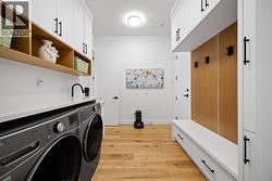 With a sink & lots of cabinetry -