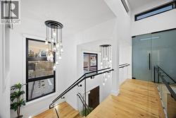 Office/den that connects the main home to the suite can be found amongst the frosted glass doors -