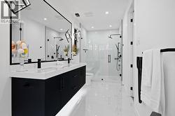 With a soaker tub, standing shower & double vanities -