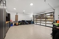 Double bay garage door with shelving installed at the back -