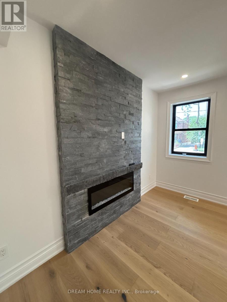 Upper - 9 Rusholme Drive E, Toronto, ON - Indoor Photo Showing Other Room With Fireplace