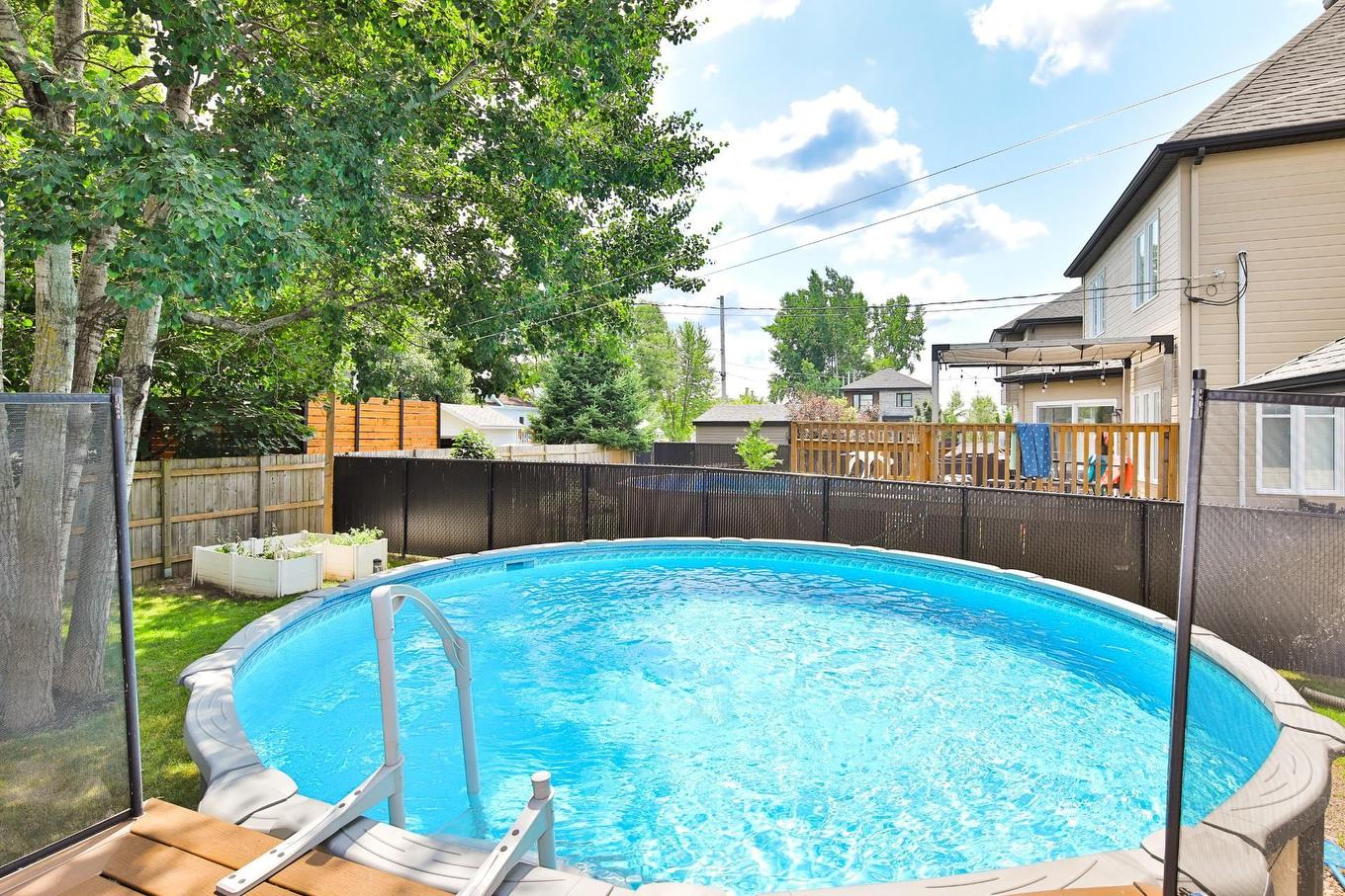 Piscine - 1529 Rue Riendeau, Chambly, QC - Outdoor With Above Ground Pool With Backyard