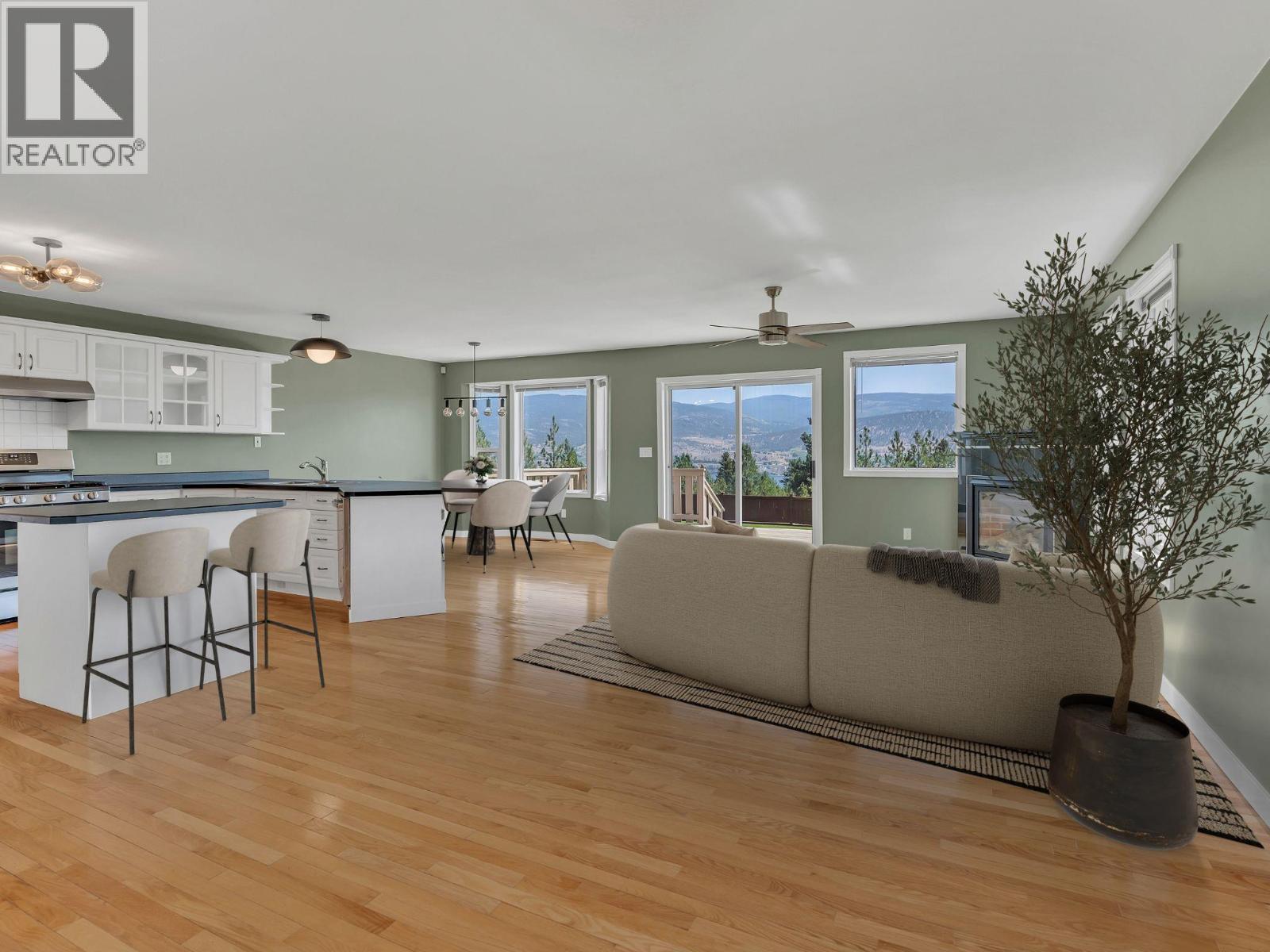 VIRTUALLY STAGED FURNITURE IN LIVING ROOM, DINING AREA AND KITCHEN - 1893 Sandstone Drive, Penticton, BC - Indoor