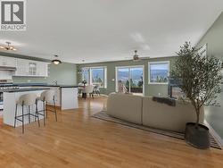 VIRTUALLY STAGED FURNITURE IN LIVING ROOM, DINING AREA AND KITCHEN -