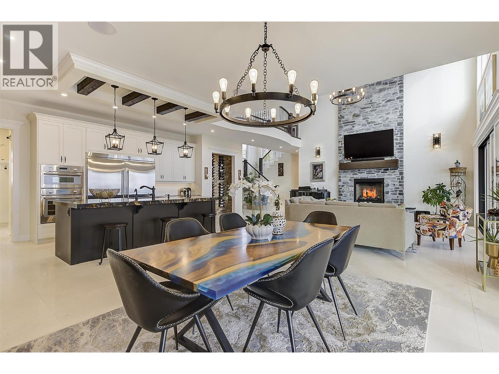 3279 Vineyard View Drive, West Kelowna, BC - Indoor Photo Showing Dining Room With Fireplace
