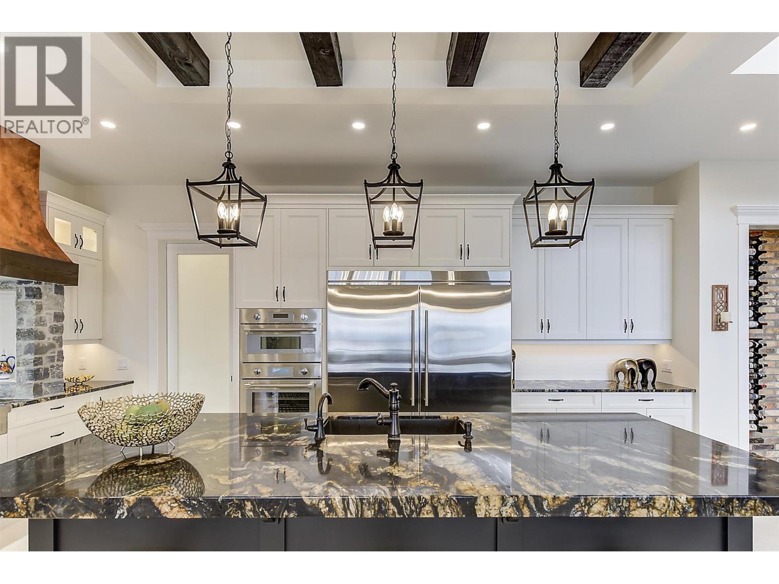 Titanium granite with triple edge on the island - 3279 Vineyard View Drive, West Kelowna, BC - Indoor Photo Showing Kitchen With Upgraded Kitchen