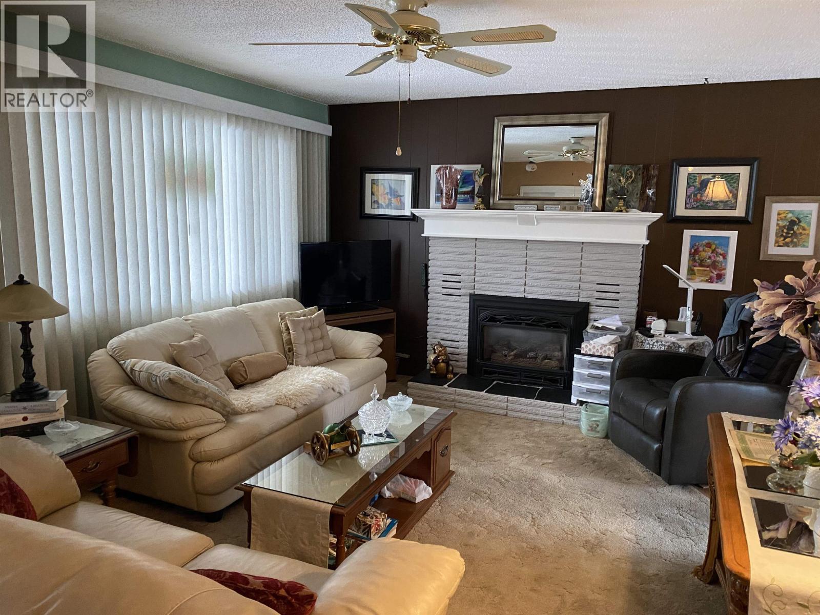 6248 E Purdue Road, Prince George, BC - Indoor Photo Showing Living Room With Fireplace