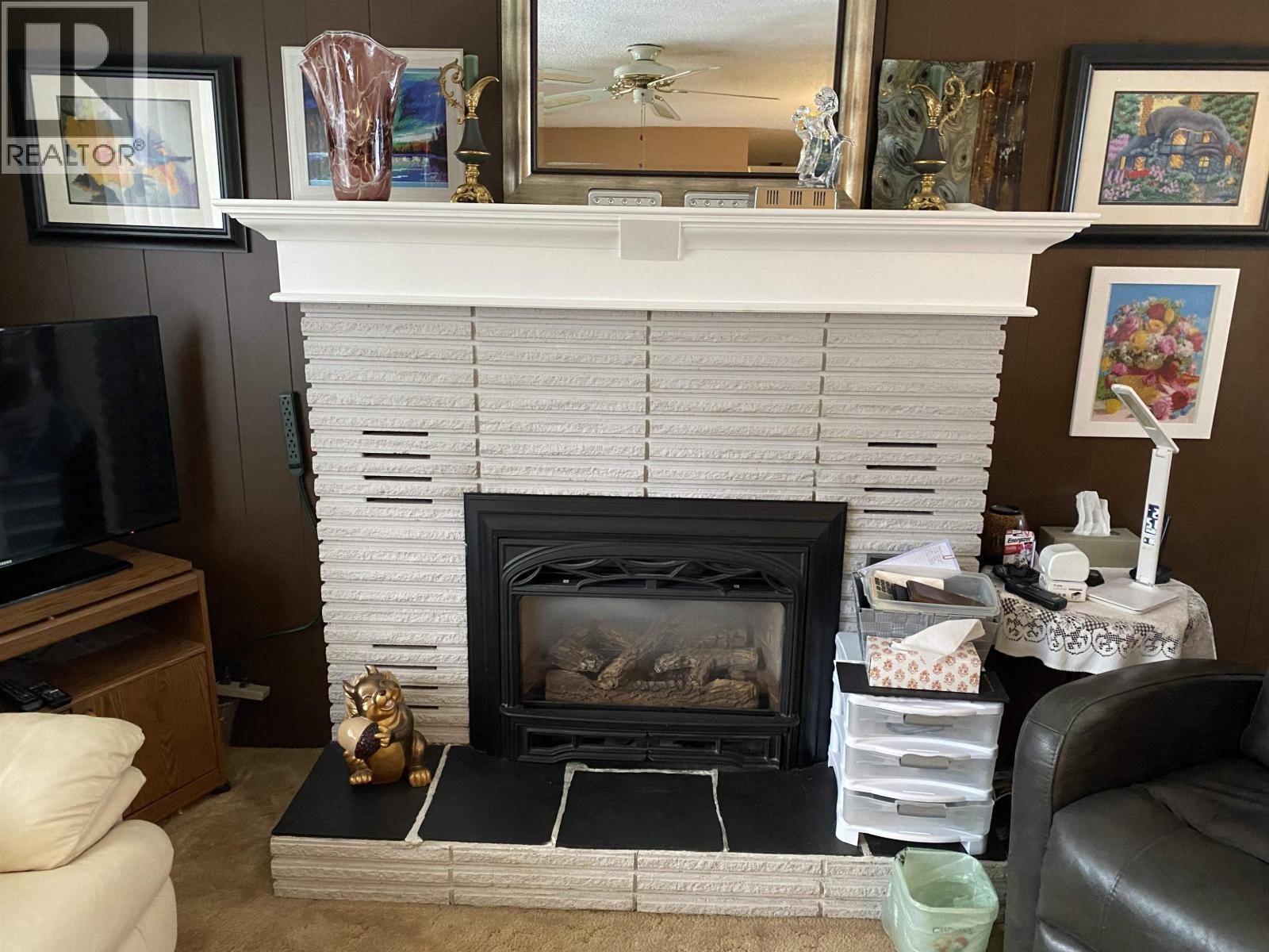 6248 E Purdue Road, Prince George, BC - Indoor Photo Showing Living Room With Fireplace