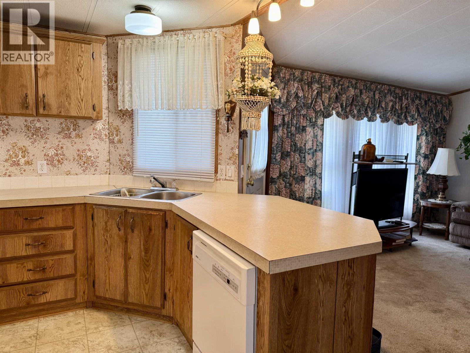 79 1000 Inverness Road, Prince George, BC - Indoor Photo Showing Kitchen With Double Sink