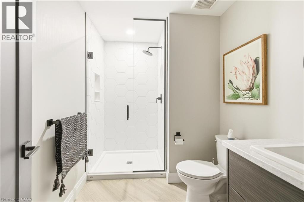 Bathroom featuring vanity and a shower stall - 26 Huron Street, Grand Bend, ON - Indoor Photo Showing Bathroom