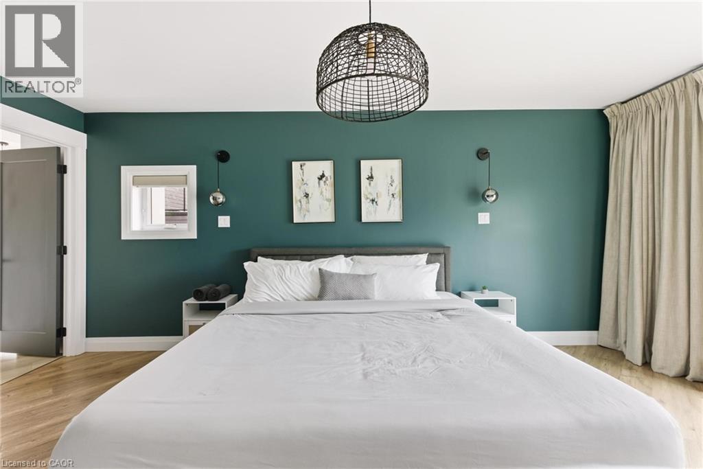 Bedroom featuring light wood finished floors - 26 Huron Street, Grand Bend, ON - Indoor Photo Showing Bedroom