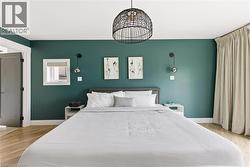 Bedroom featuring light wood finished floors -