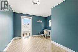 Office area featuring light wood-type flooring and healthy amount of natural light -