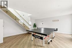 Playroom with light wood-style flooring -