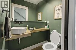 Bathroom featuring vanity and wood finished floors -