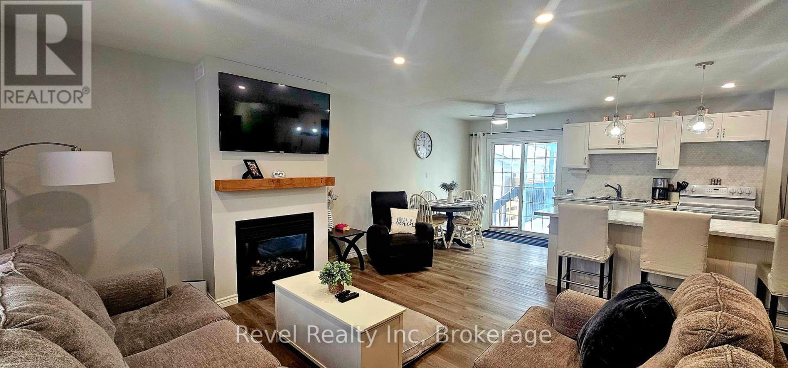 110 Wolfe Trail, Tiny, ON - Indoor Photo Showing Living Room With Fireplace