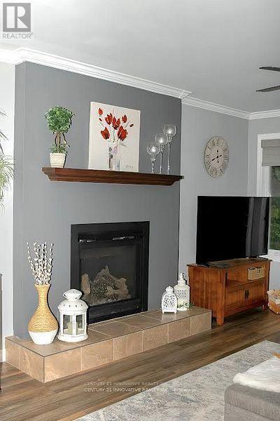 15 Ainsworth Drive, Ramara, ON - Indoor Photo Showing Living Room With Fireplace
