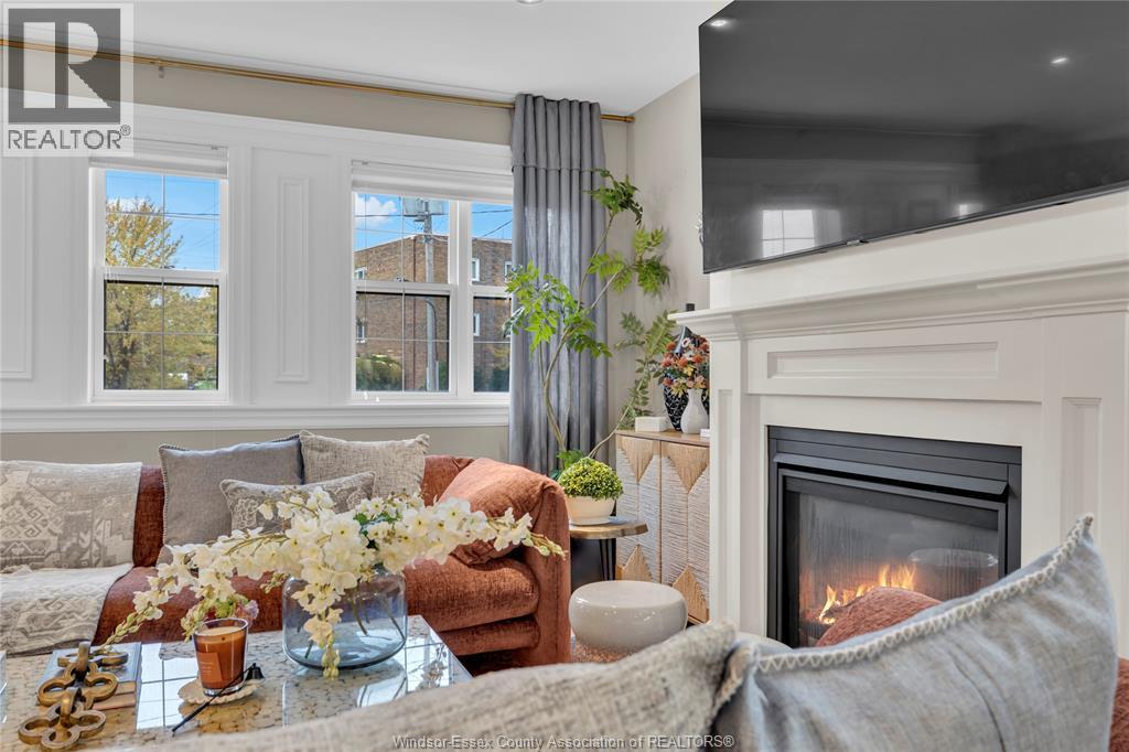 8475 Wyandotte Unit# 116, Windsor, ON - Indoor Photo Showing Living Room With Fireplace