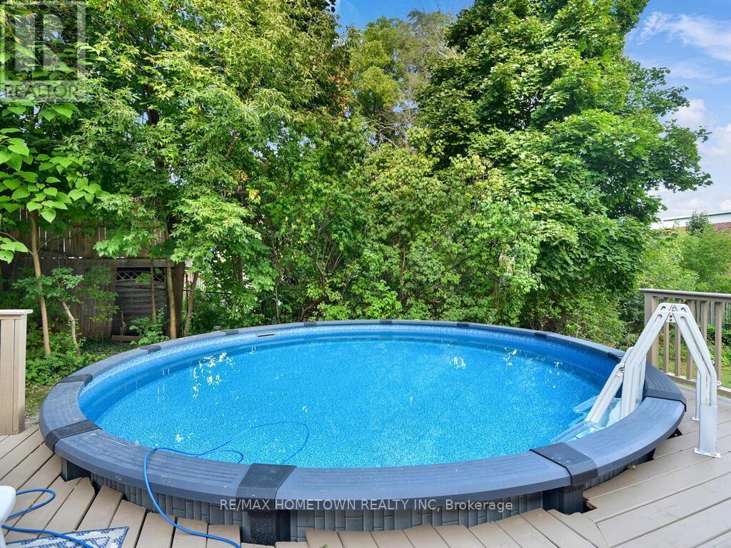 157 Dibble Street W, Prescott, ON - Outdoor With Above Ground Pool With Deck Patio Veranda With Backyard